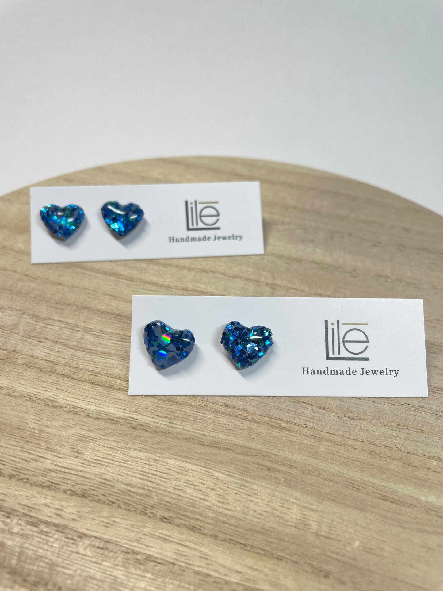 Blue glitter heart studs