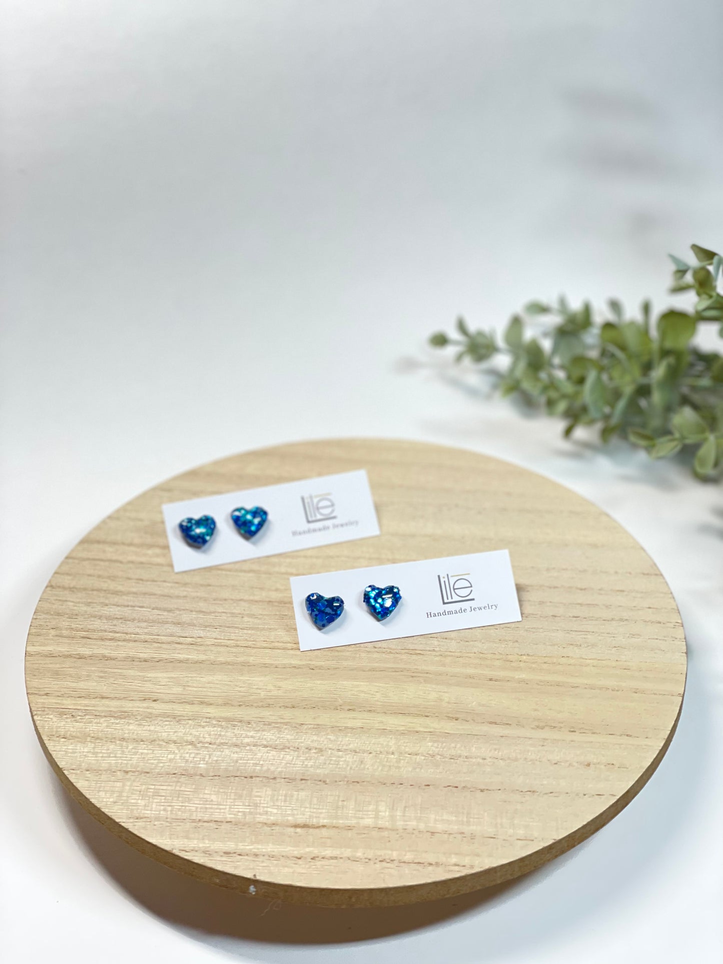 Blue glitter heart studs